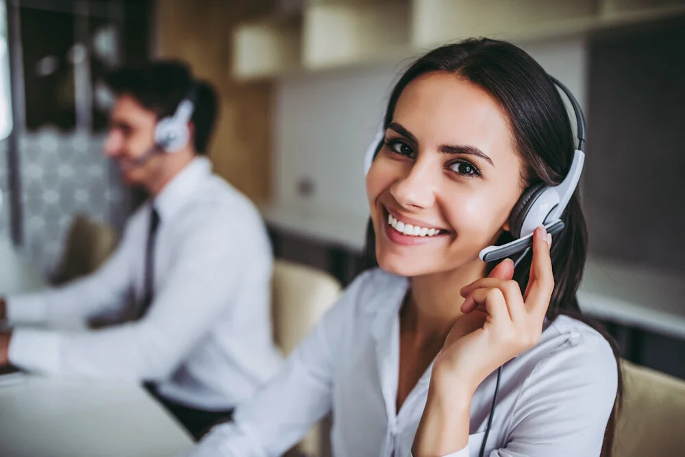 Smiling call center agent with headset